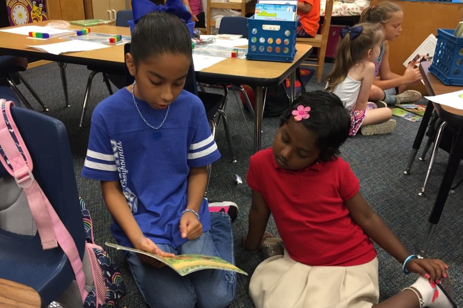 During book buddy time, a Galatas fourth grader and a kindergarten student read books together.