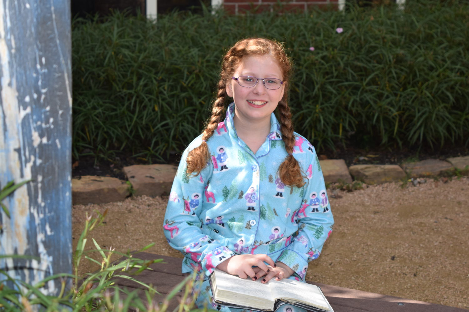 A Mitchell Intermediate student enjoyed reading enjoyed reading in the nice fall weather.