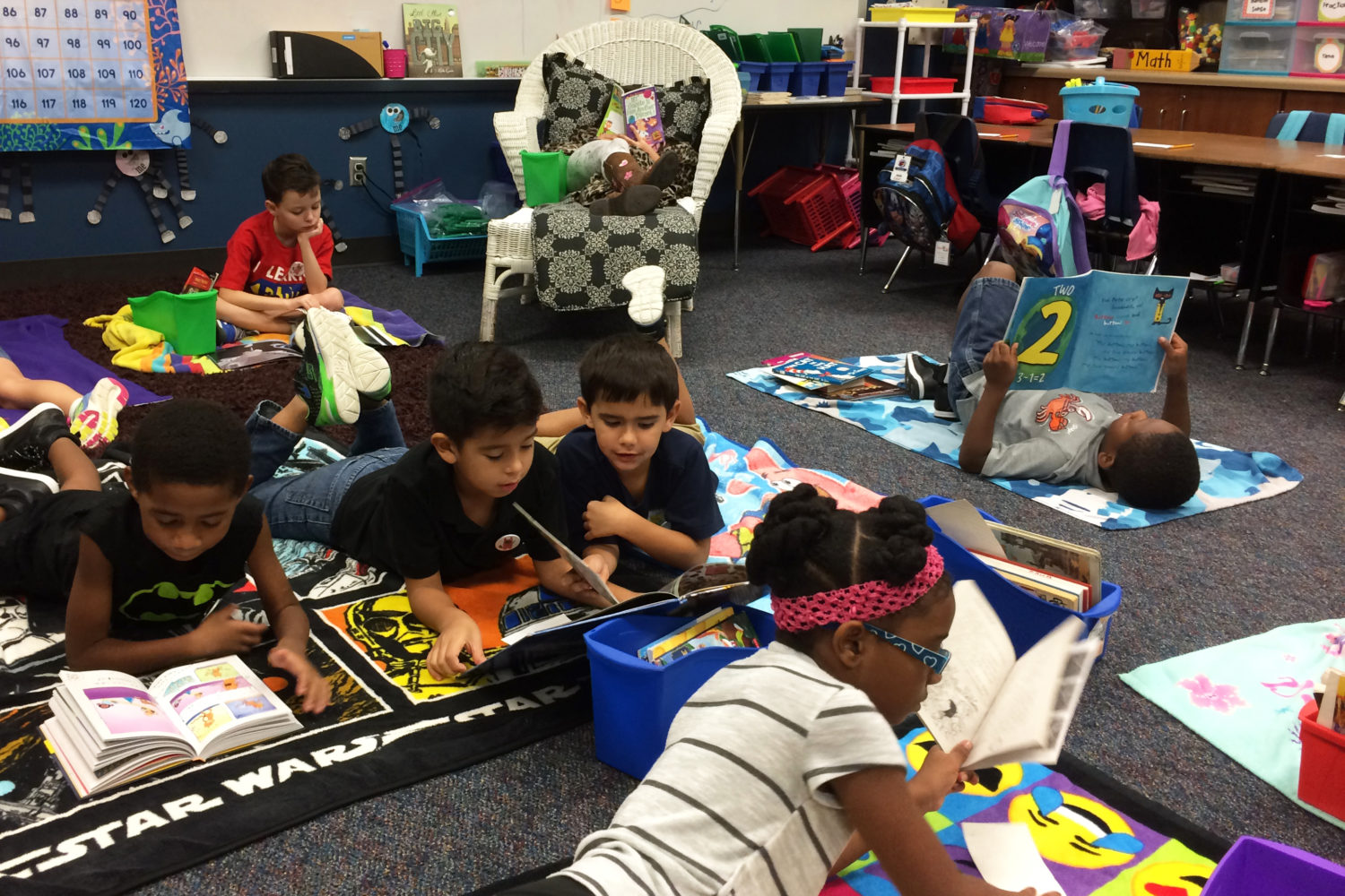 Students from Ford Elementary get comfortable for reading during Mrs. Baus' class.