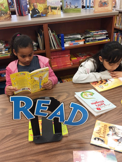 Students at Reaves Elementary enjoy library time with friends.