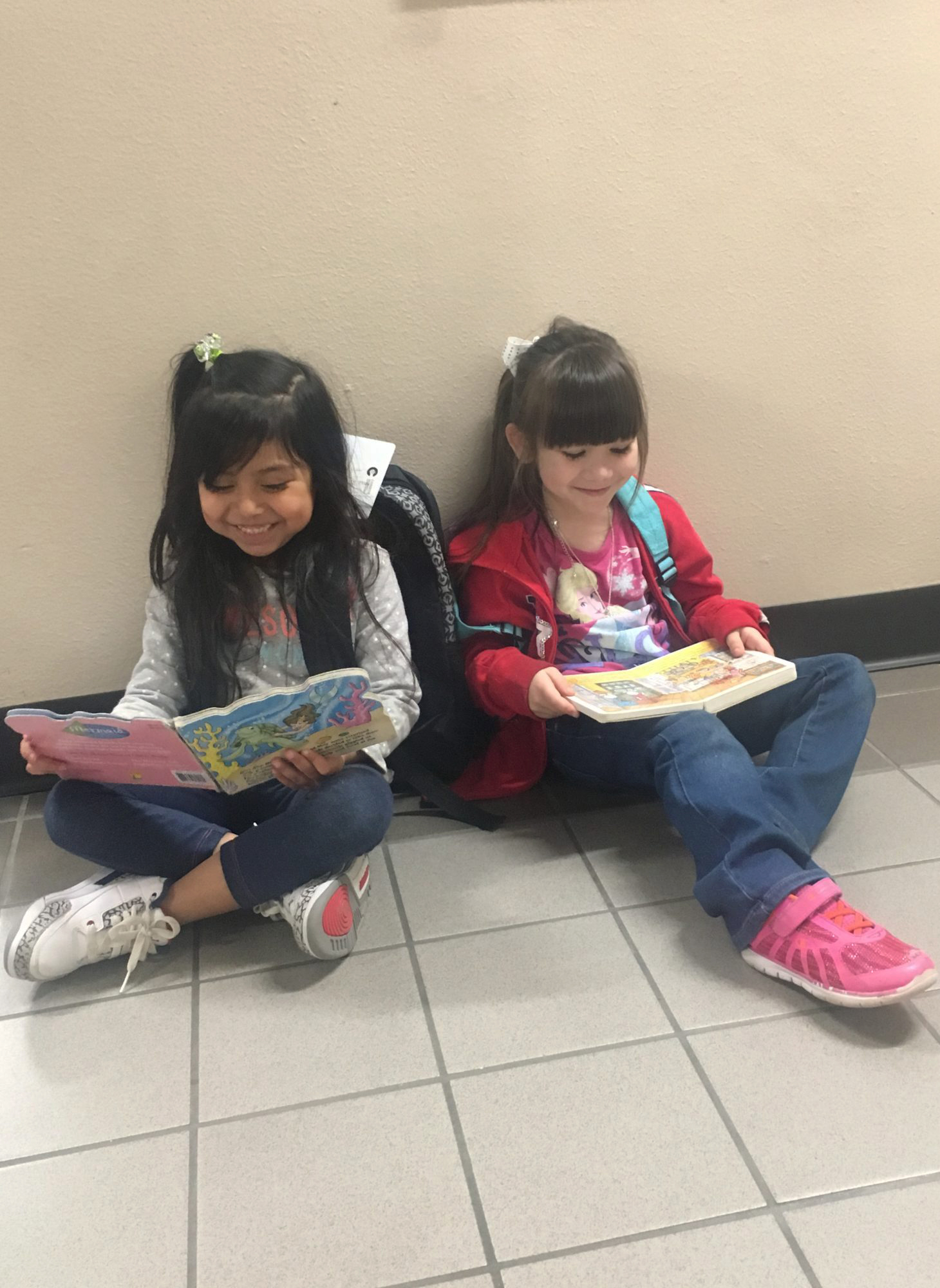 Friends at Creighton Elementary enjoy reading together.
