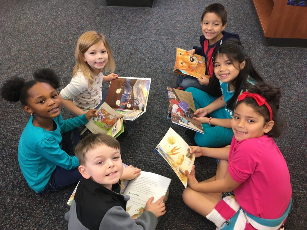 Ford second graders enjoy reading in the library with friends.