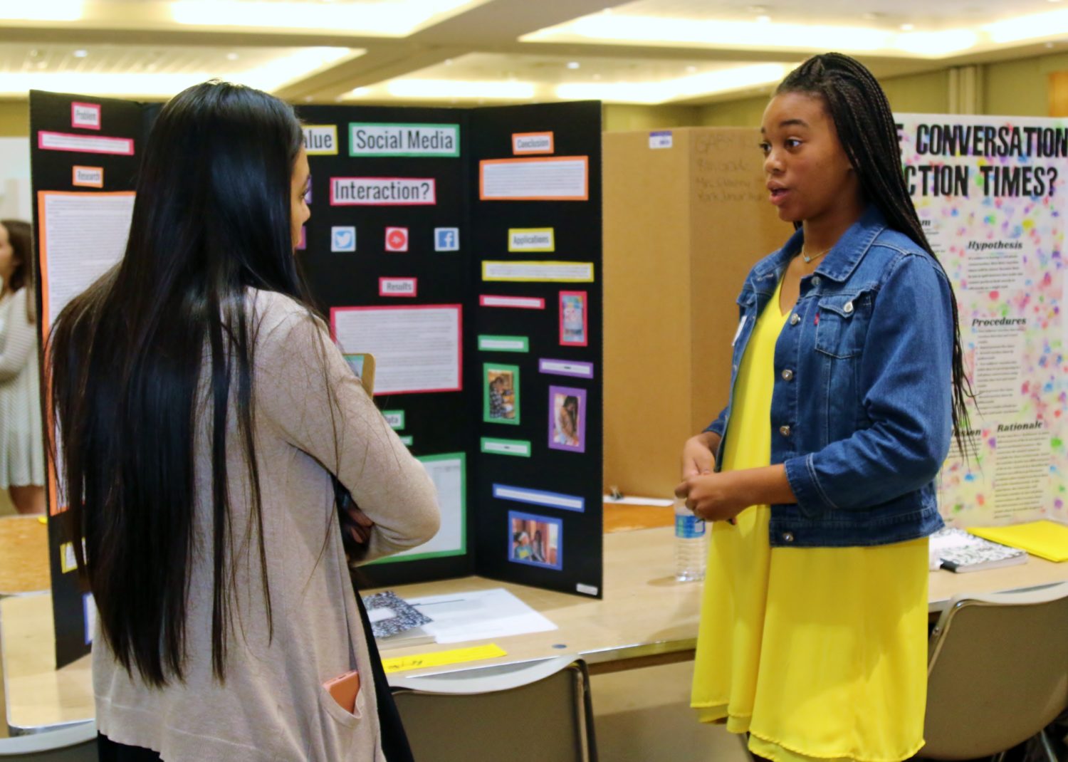 A McCullough JH student explains her project at the Sci://Tech Junior High Science Fair at the Lone Star Convention Center on Friday.