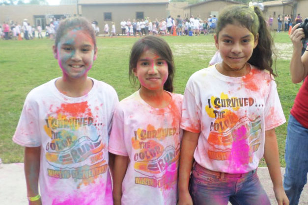 Students at Austin Elementary smile for a picture after completing the Color Run.