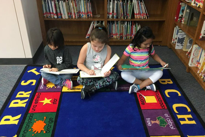 Creighton Elementary students spent some time reading the library with friends.