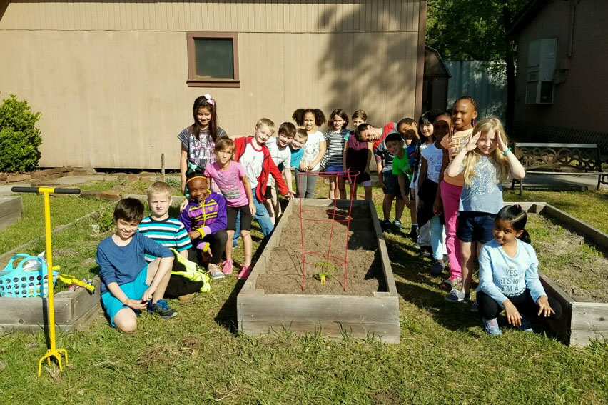Mrs. Hayes' second graders at Hailey Elementary planted seeds and tomatoes in the school garden.