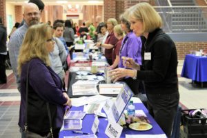 Attendees interact with exhibitors at the 13th Annual Resource and Transition Fair.