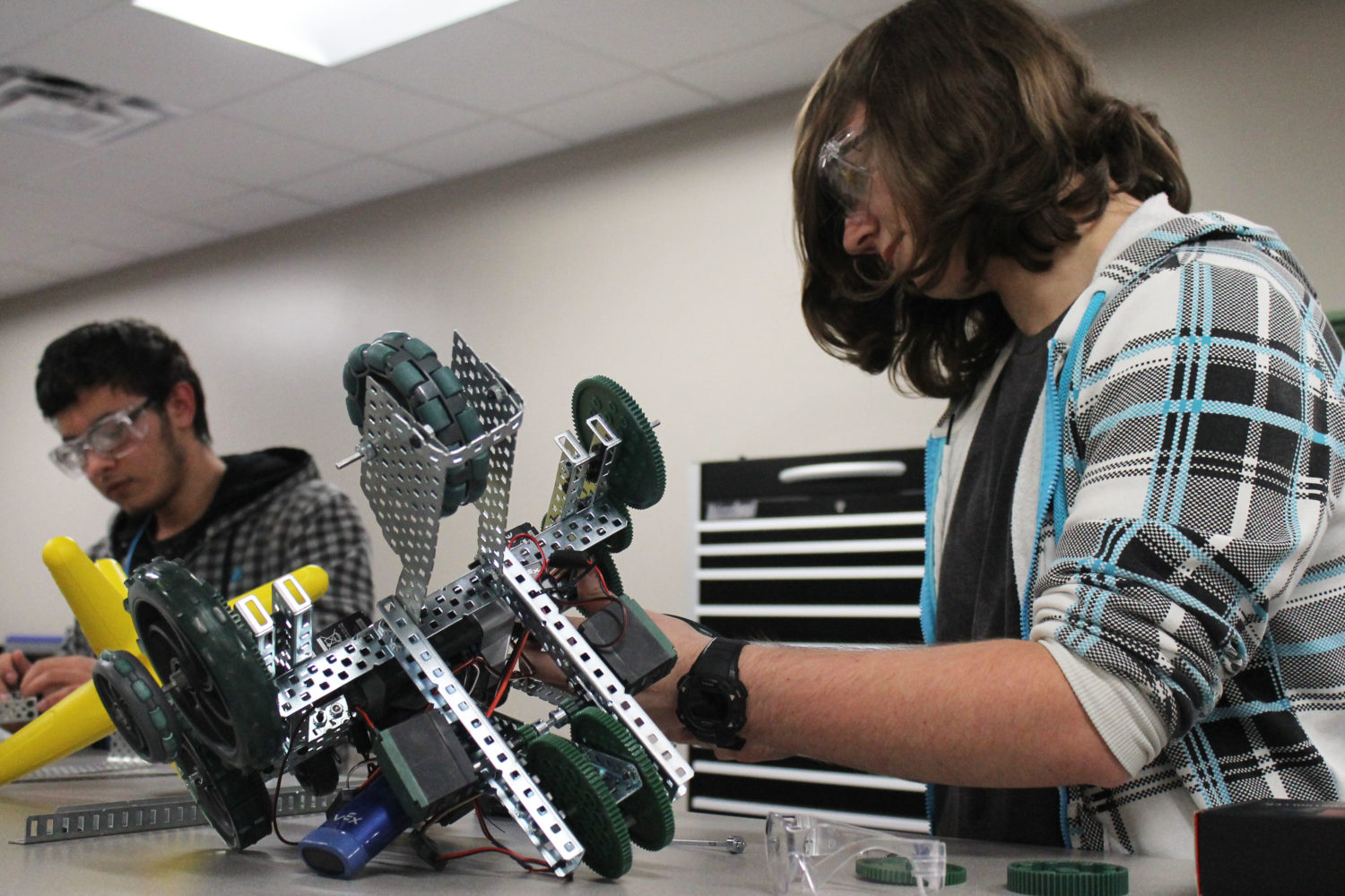 Caney Creek HS students work on robots in their new robotics lab.