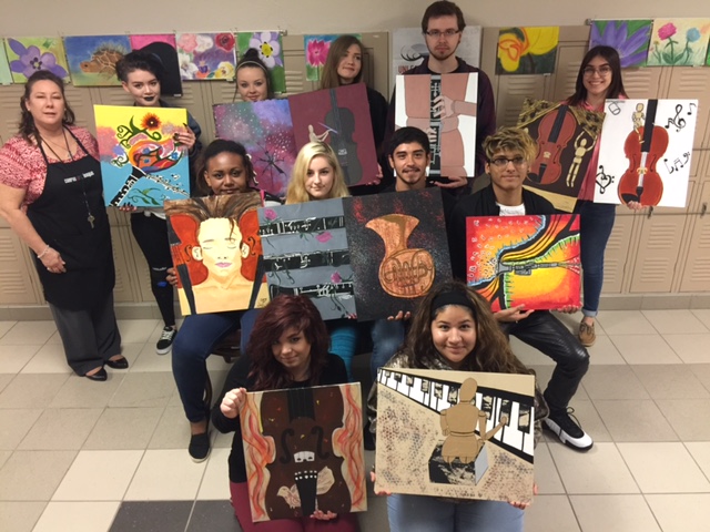 Hauke High School Painting II students show off their pieces that will be on display at Conroe High School on Saturday, April 22 from 6:30-9:30 p.m. as part of the "The Art of Melody" exhibit.