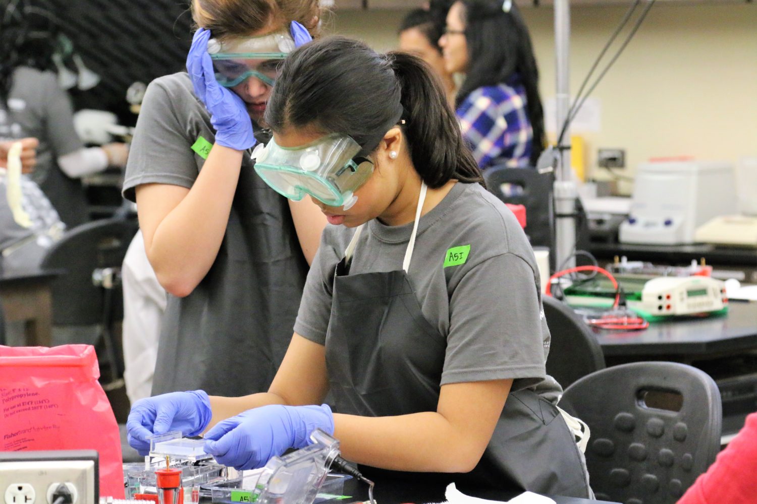 two girls compete in a biotechnology competition