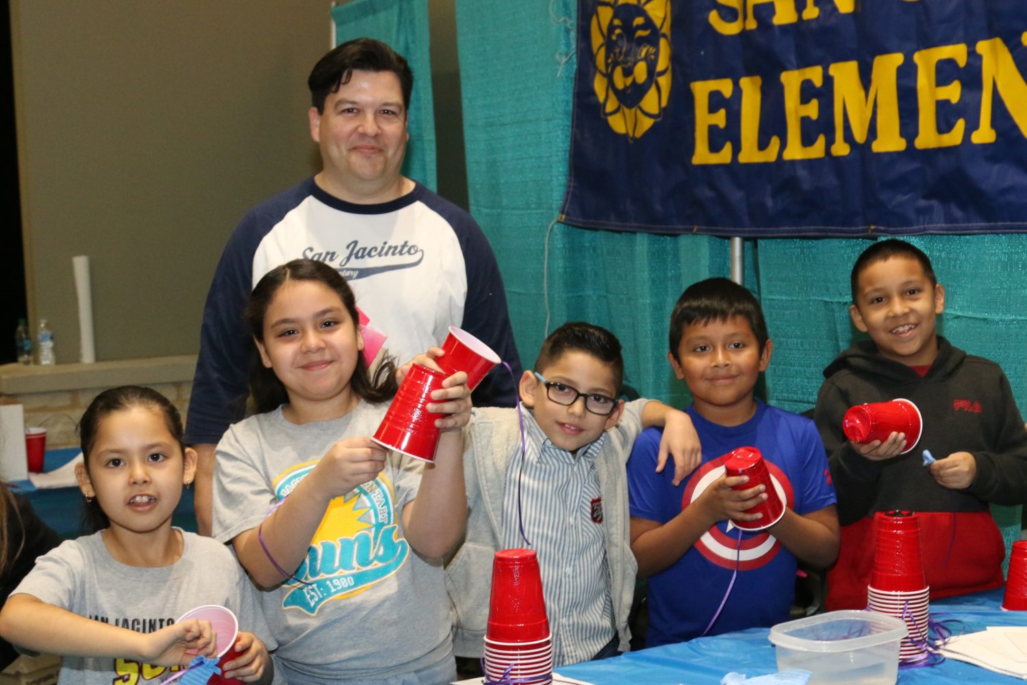 students pose for a picture at a science fair