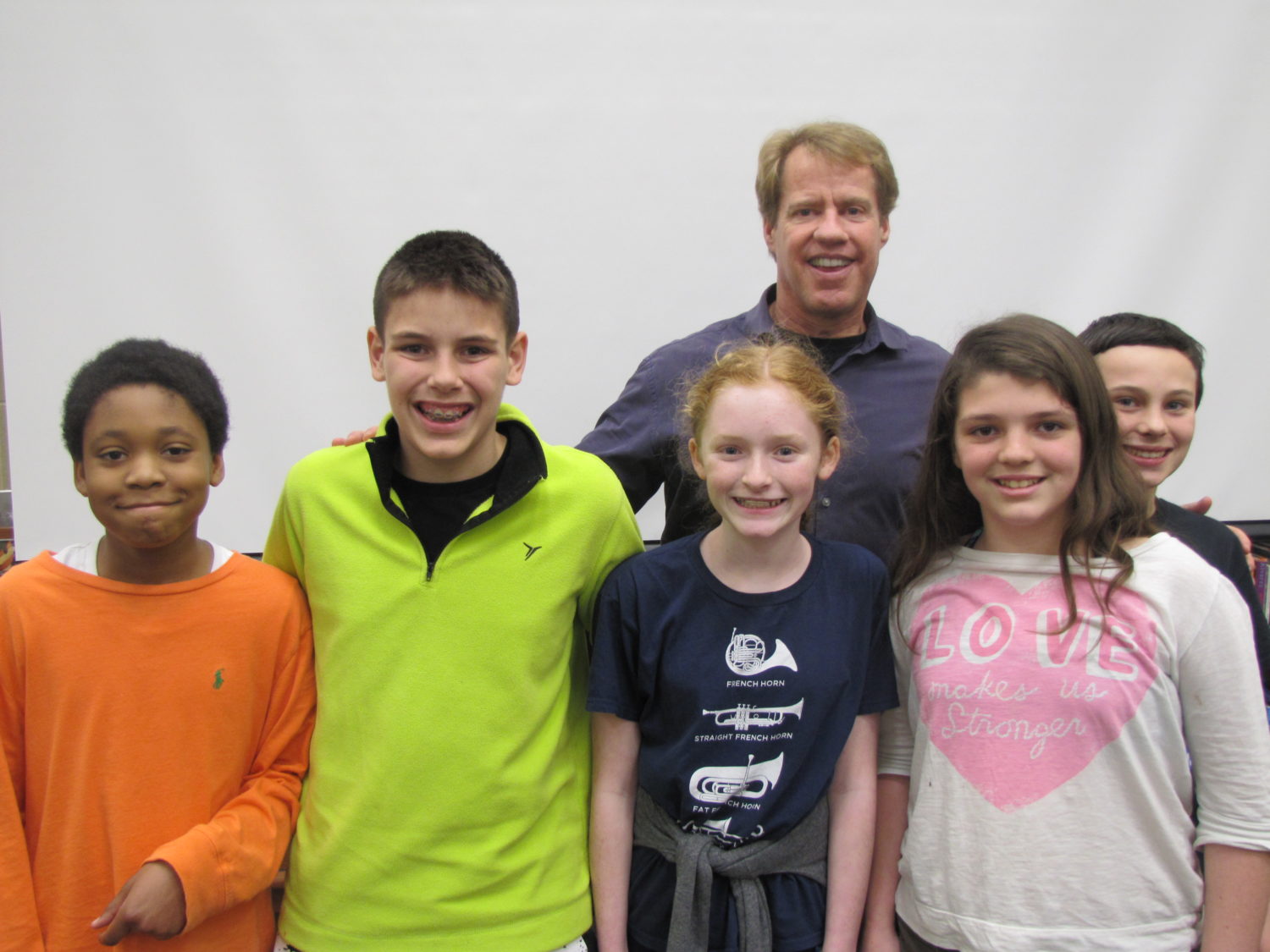 five students pose with author, Jeff Savage