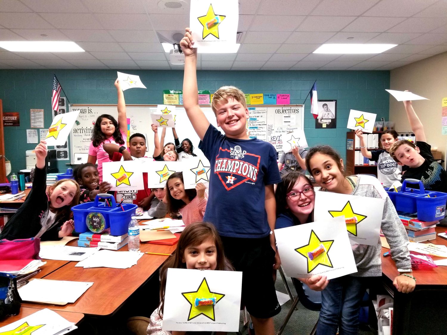 a class displays their teacher created certificates for STAAR testing