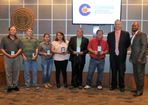 4 male and 2 female custodial and maintenance employees receive award at Board Meeting.