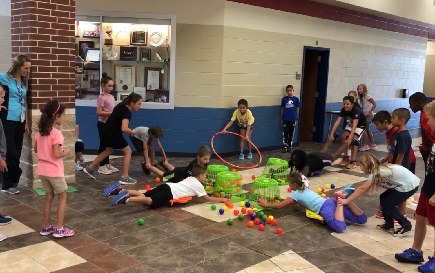 "a group of students play Hungry Hungry Hippos"