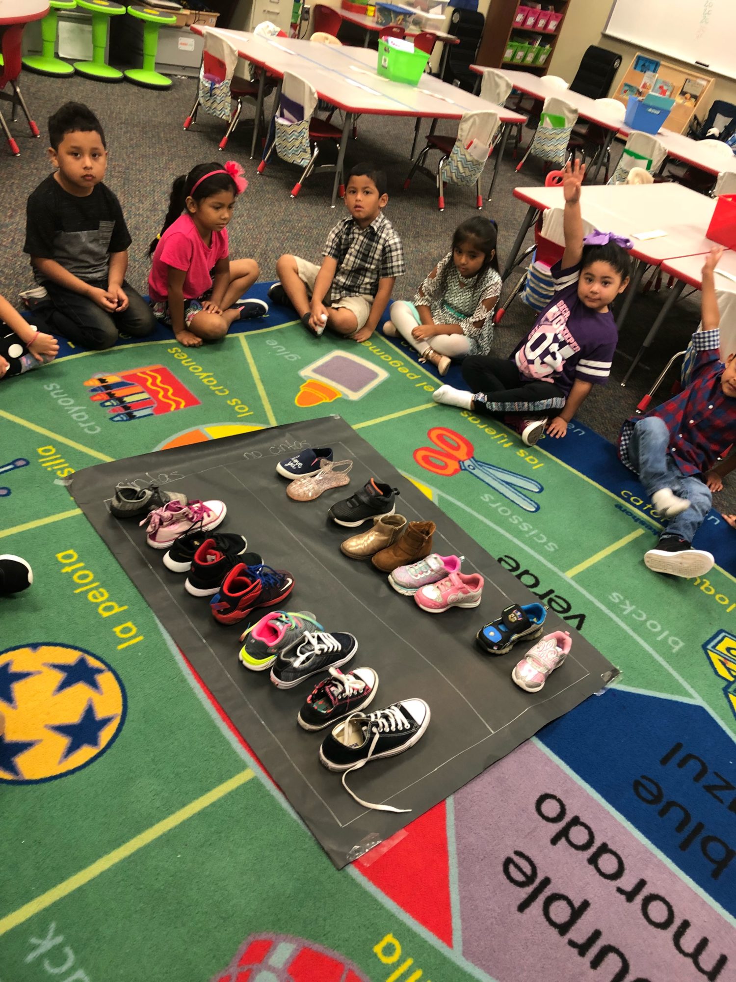 "a group of students graph using their tennis shoes"