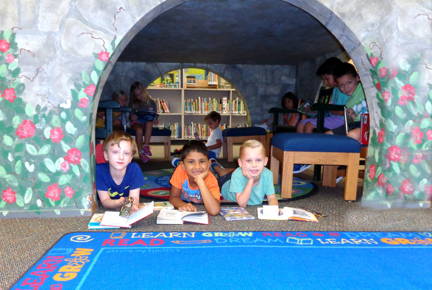 "a group of students read in a castle"