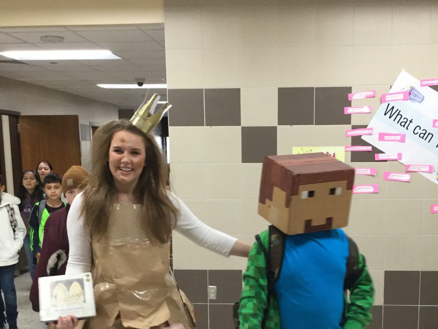 "a student and teacher dress for a character parade"