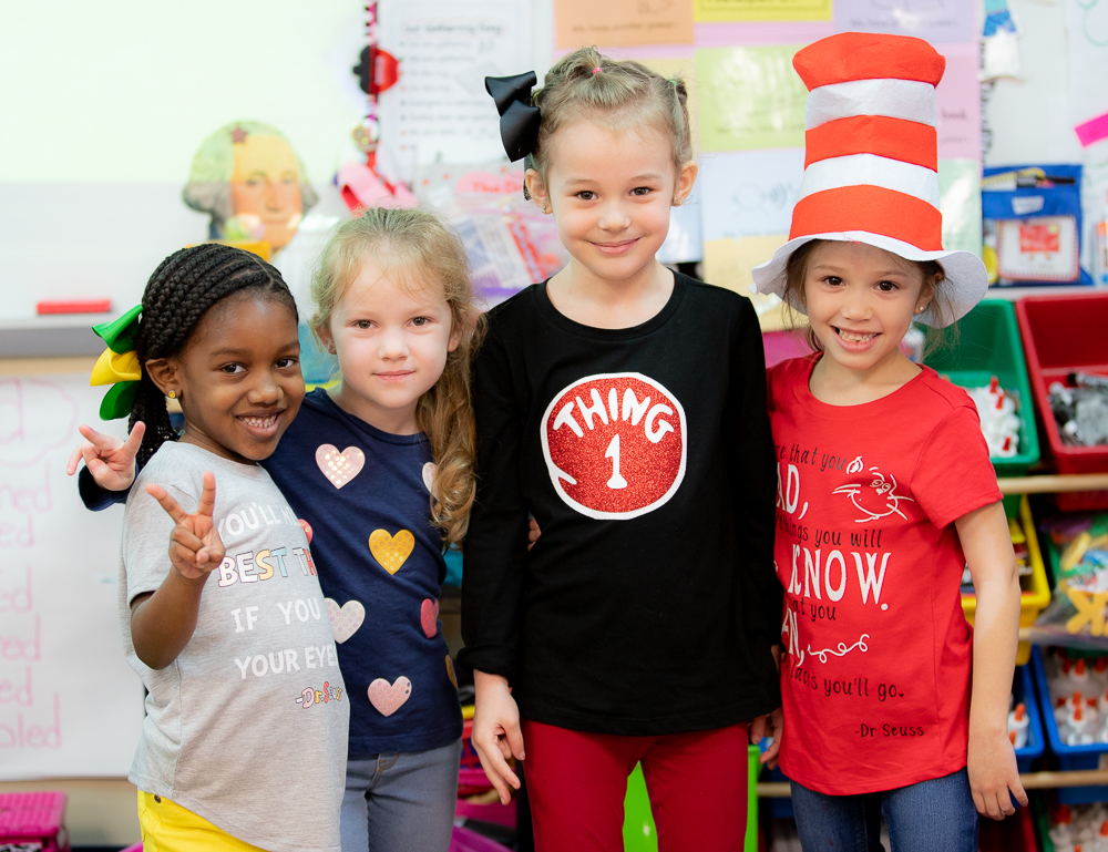 "a group of girls celebrate Dr. Seuss"