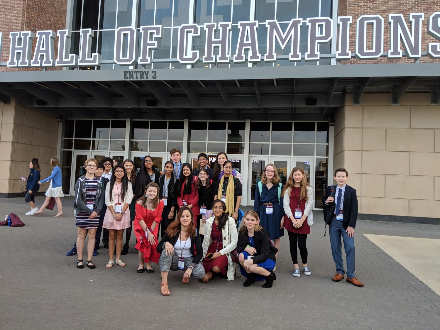 "a group of students pose for a picture at the state science fair"