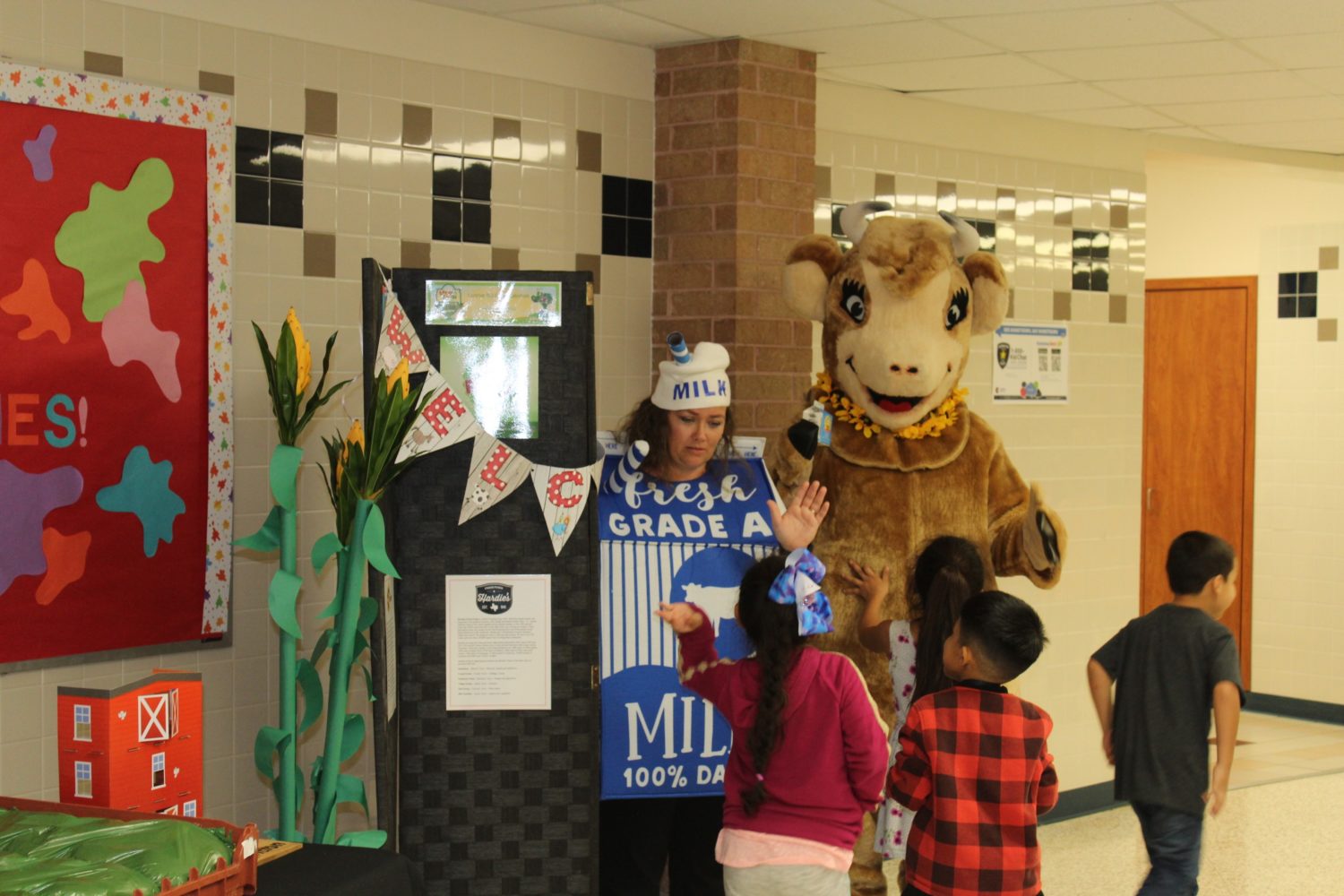 "students line up to see Elsie the Cow"