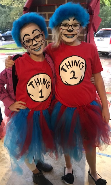 "two children dress like Thing 1 and Thing 2"