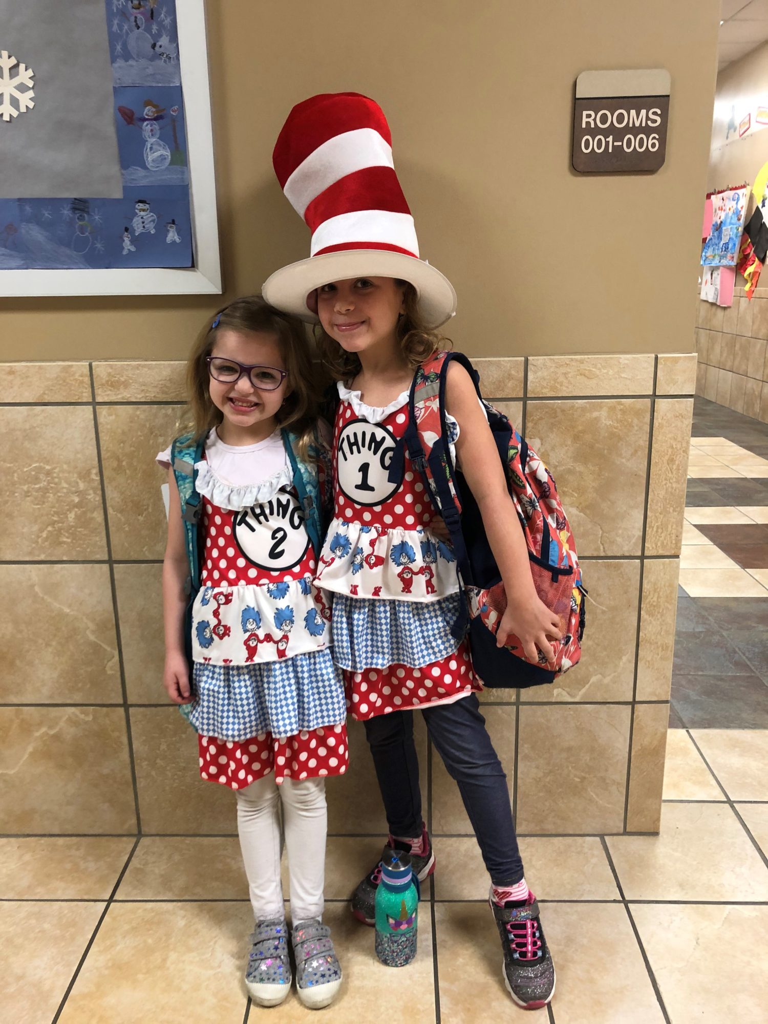 "two girls dressed in Dr. Seuss clothing pose for a picture"