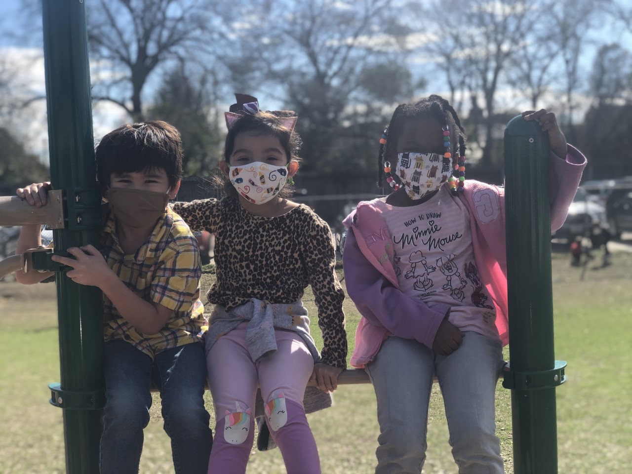 Students smile for the camera while at recess.