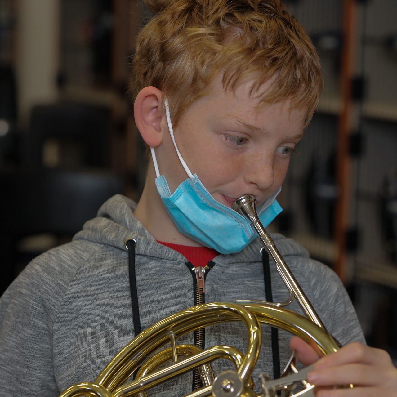 " A student plays their instruments during music class"