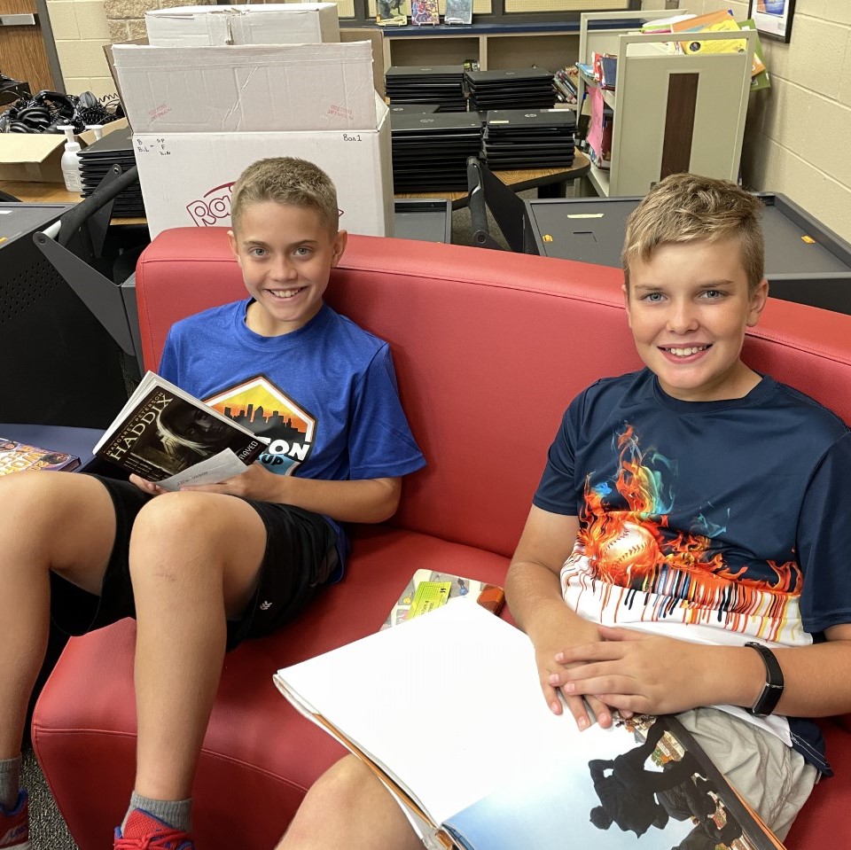 Students at Vogel read a book during their first library visit of the school year!