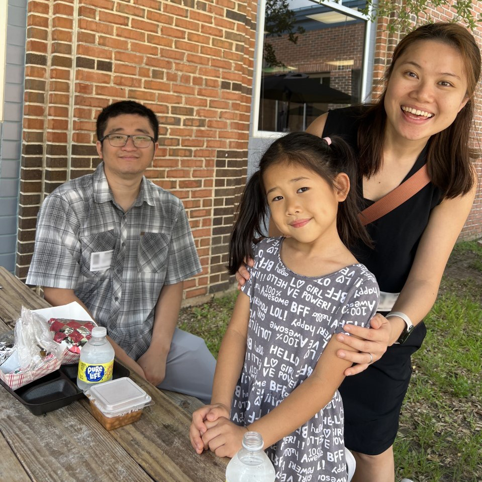 A student at Galatas enjoys an outdoor lunch with her family!